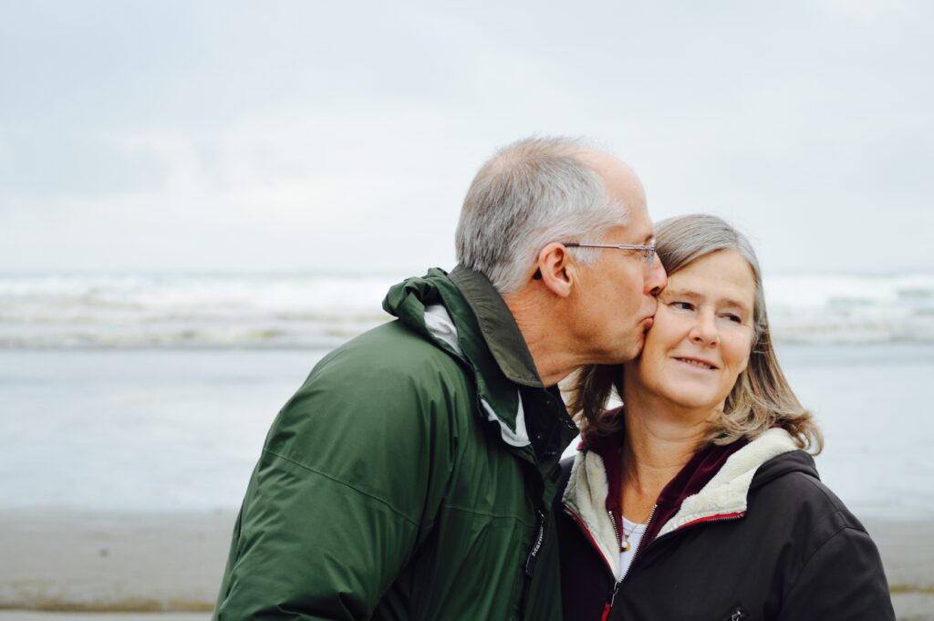 Man kissing woman on a beach