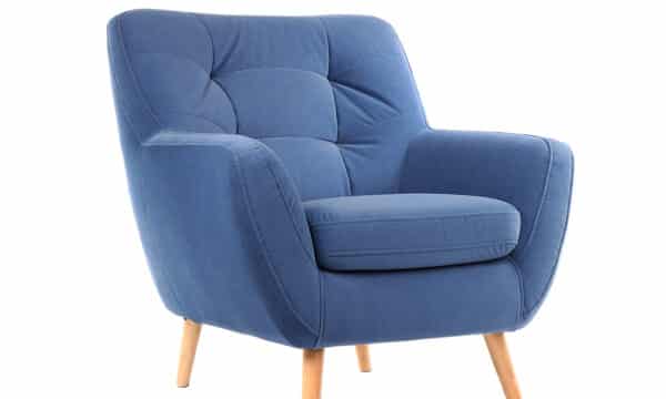A plush blue chair with wooden legs.